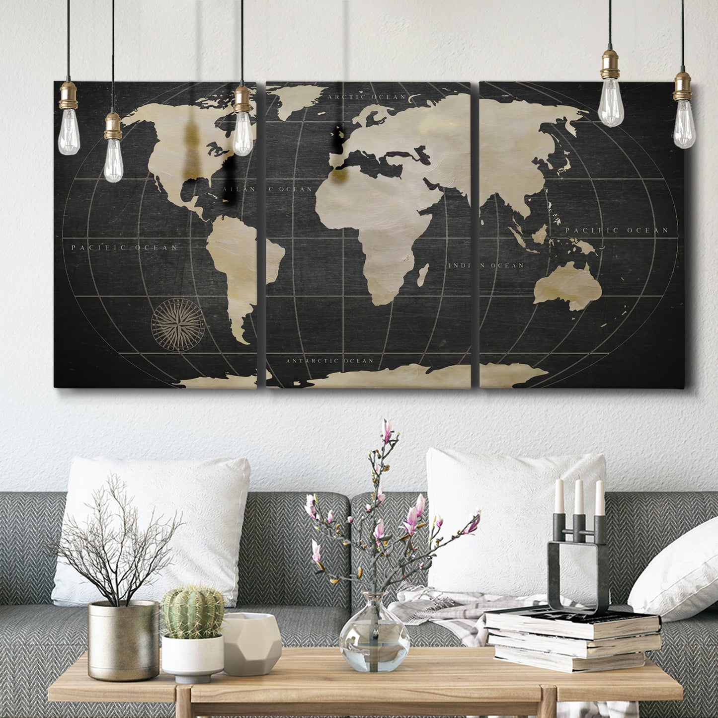 Three-panel canvas wall art featuring antique world map illustration, displayed in a modern living room above seating.