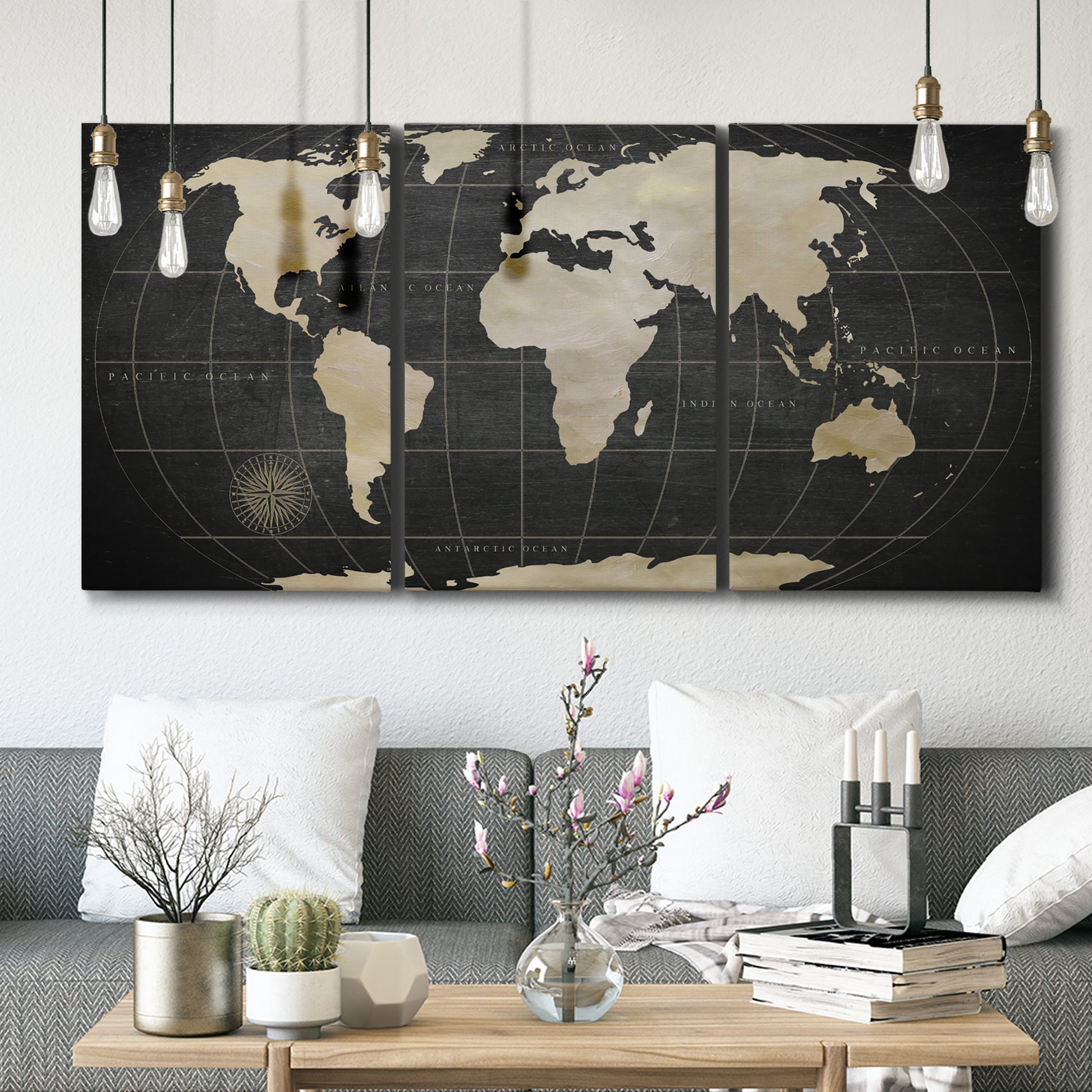 Three-panel canvas wall art featuring antique world map illustration, displayed in a modern living room above seating.