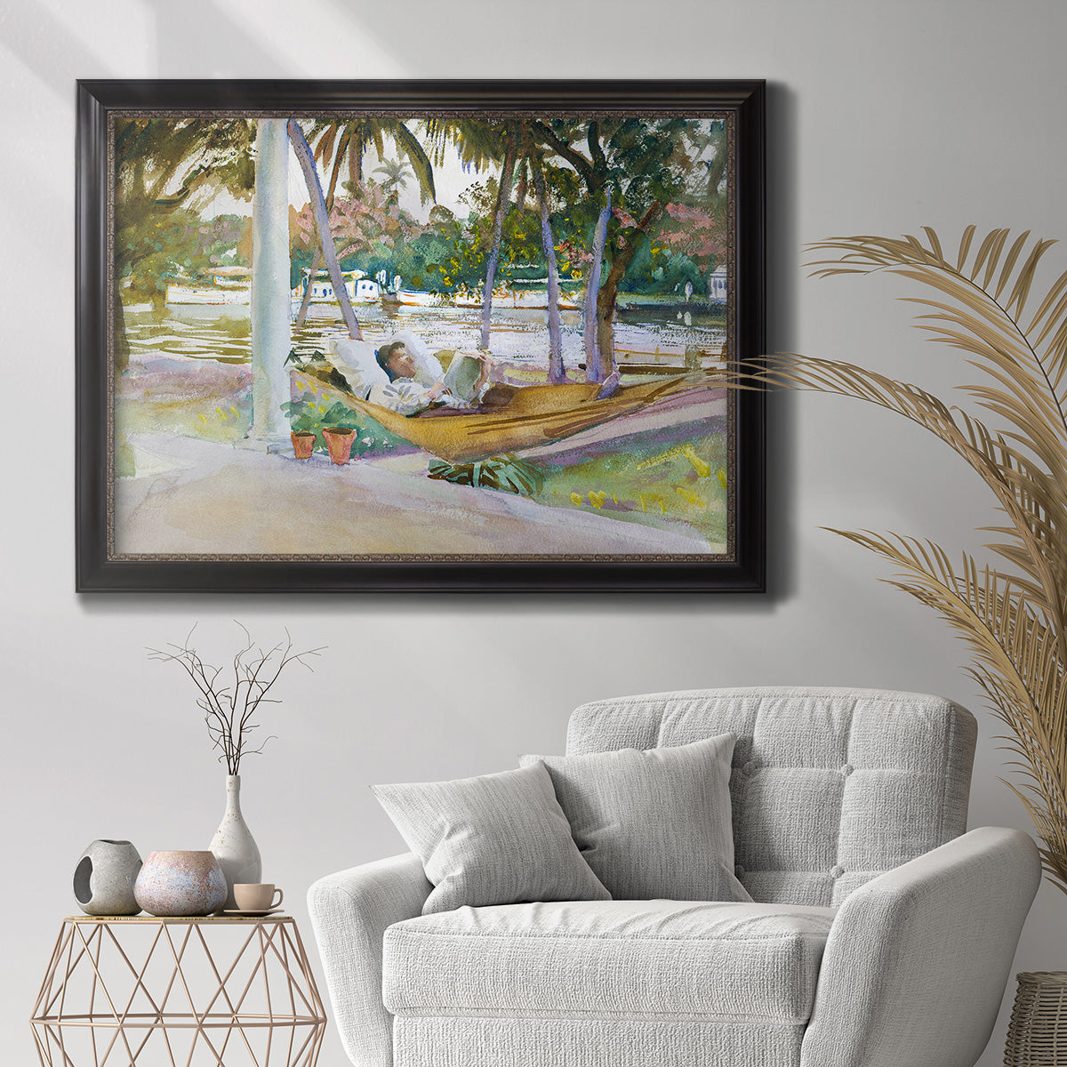 Impressionist leisure portrait scene by John Singer Sargent in an ornate black frame with gilded inner detail displayed in a bright interior setting.