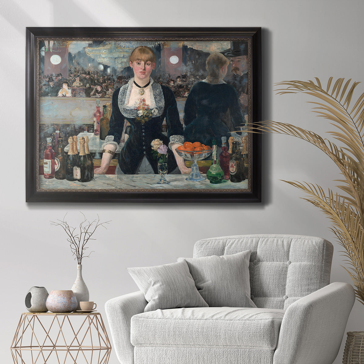 Iconic impressionist café bar scene by Édouard Manet in an ornate black frame with gilded inner detail displayed in a bright interior setting.