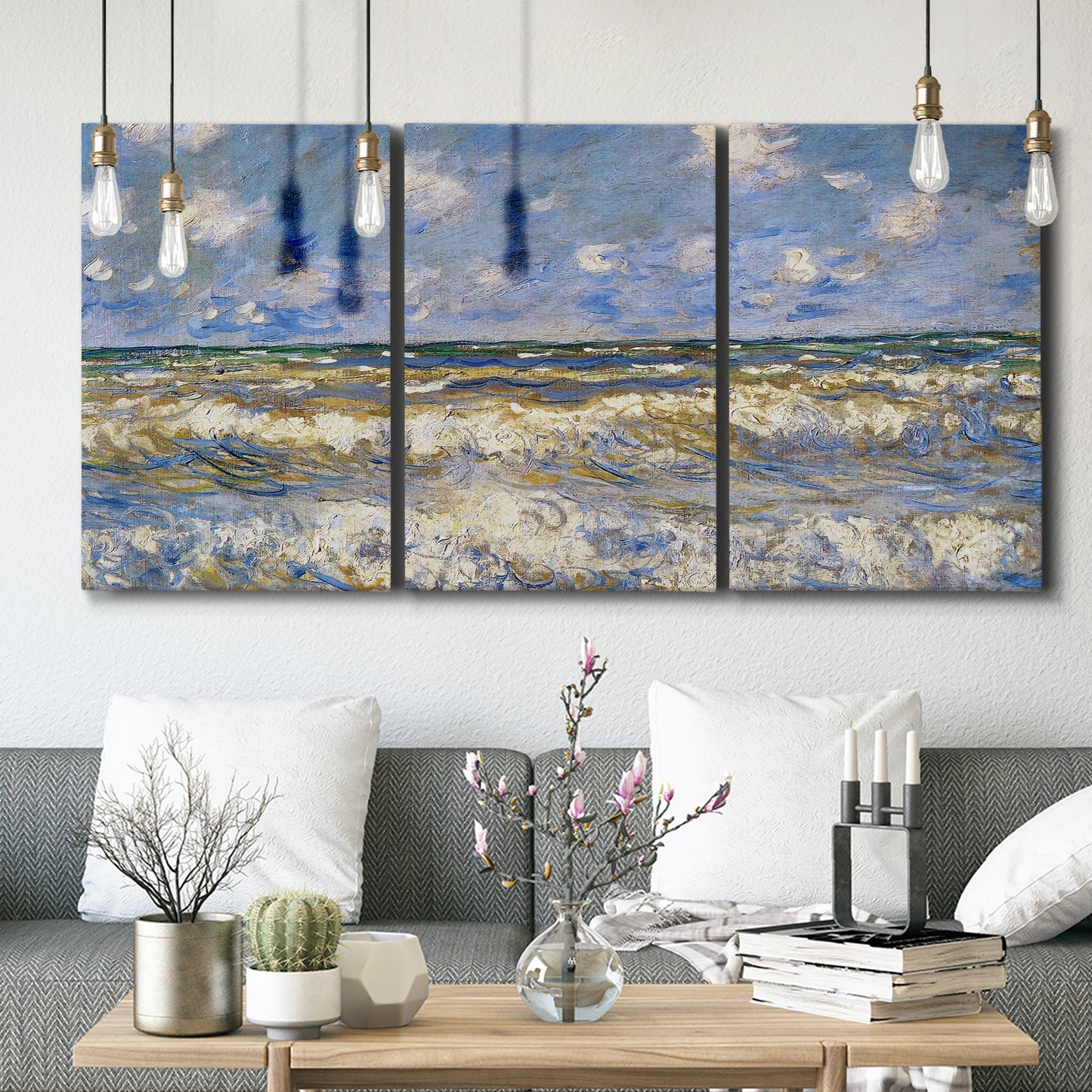 Three-panel canvas wall art featuring rough sea with crashing waves, displayed in a modern living room above seating.