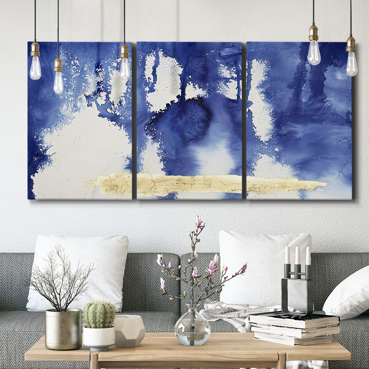 Three-panel canvas wall art featuring saturated abstract color fields, displayed in a modern living room above seating.