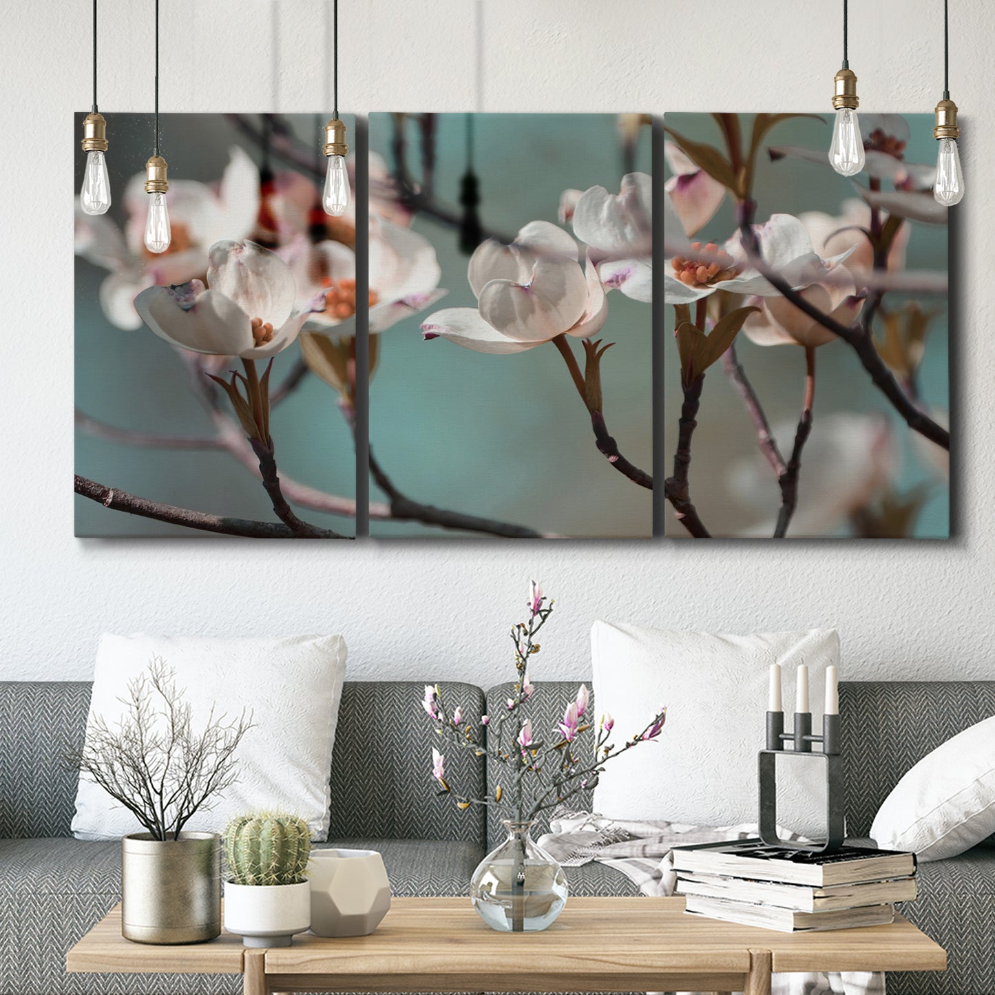 Three-panel canvas wall art featuring dogwood blossoms in spring photograph, displayed in a modern living room above seating.