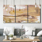 Three-panel canvas wall art featuring layered abstract dawn tones, displayed in a modern living room above seating.