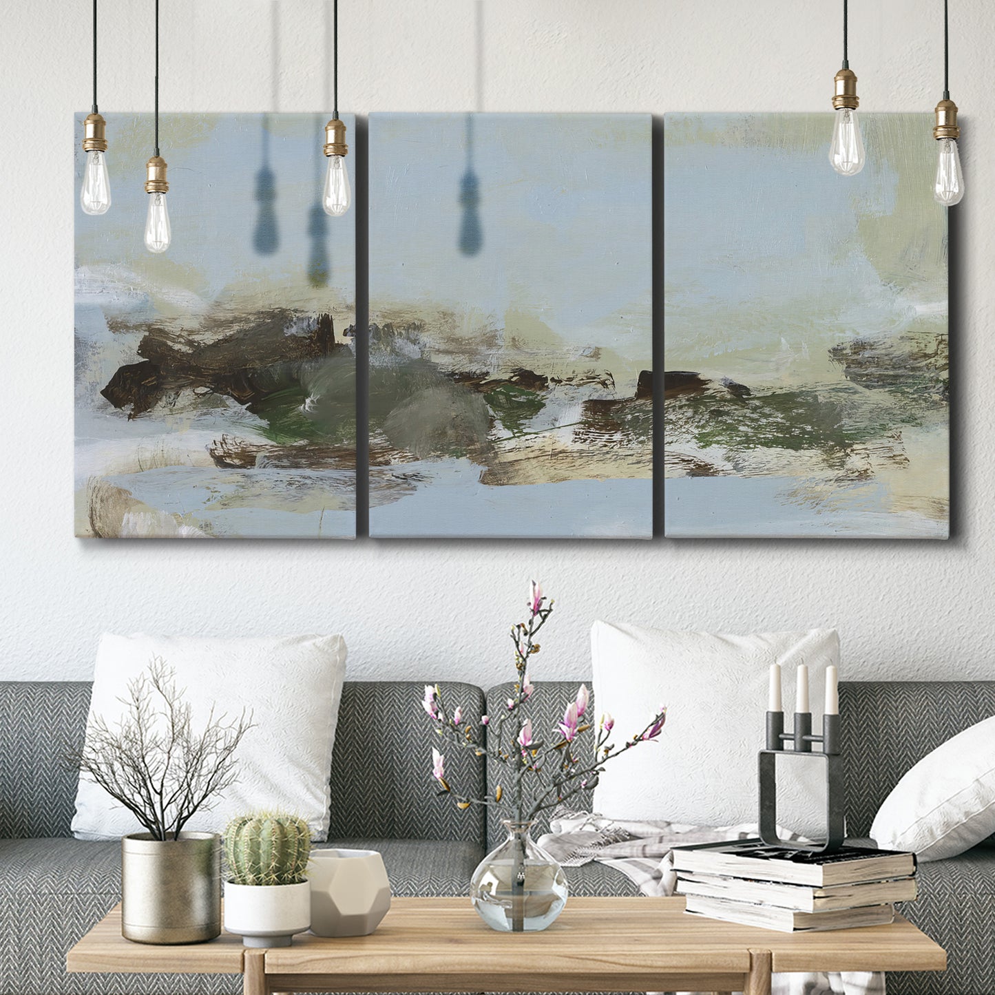Three-panel canvas wall art featuring minimal abstract summer landscape, displayed in a modern living room above seating.