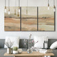 Three-panel canvas wall art featuring earth toned abstract landscape, displayed in a modern living room above seating.