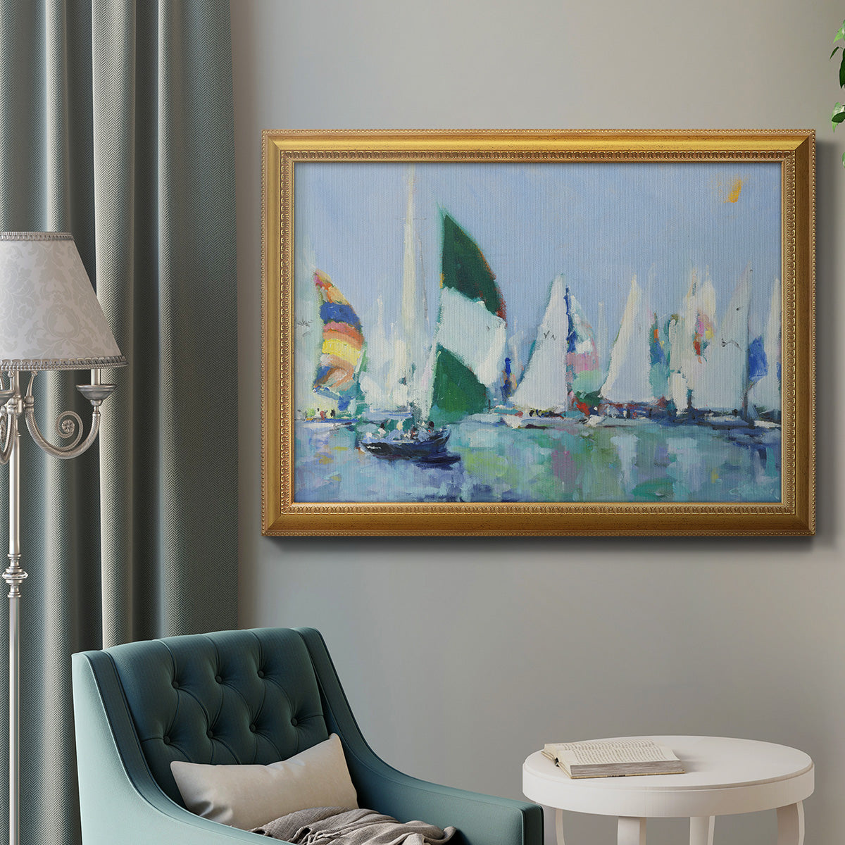 Coastal harbor watercolor painting in an ornate antique gold frame displayed in a neutral interior setting.