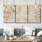 Three-panel canvas wall art featuring ornamental damask abstract pattern, displayed in a modern living room above seating.