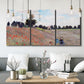 Three-panel canvas wall art featuring poppy field stretching across meadow, displayed in a modern living room above seating.