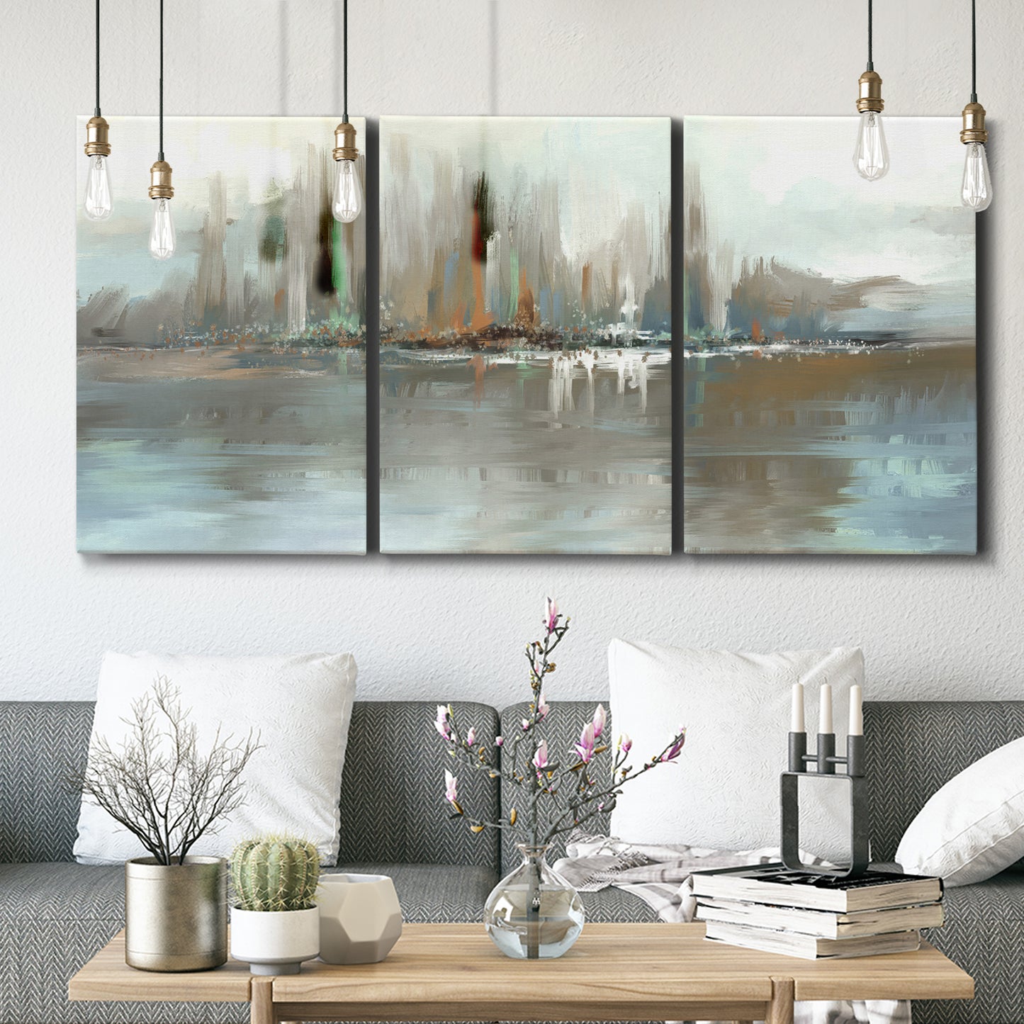 Three-panel canvas wall art featuring glowing abstract city lights, displayed in a modern living room above seating.