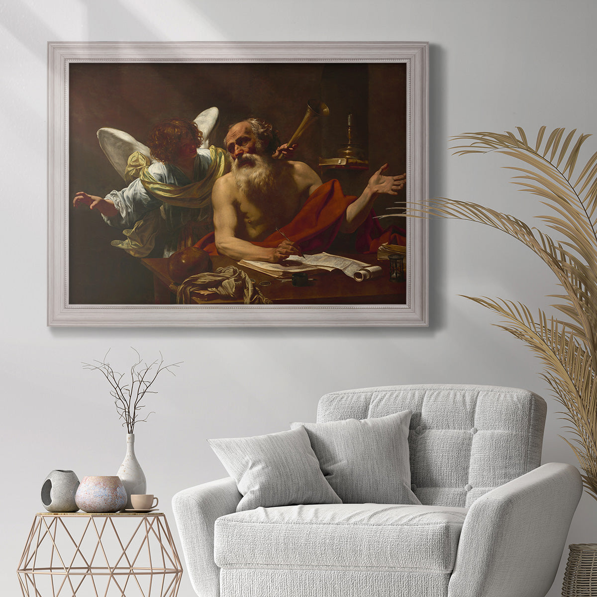 Classical religious painting of Saint Jerome with an angel by Simon Vouet in an ornate weathered white frame displayed in a bright interior setting.