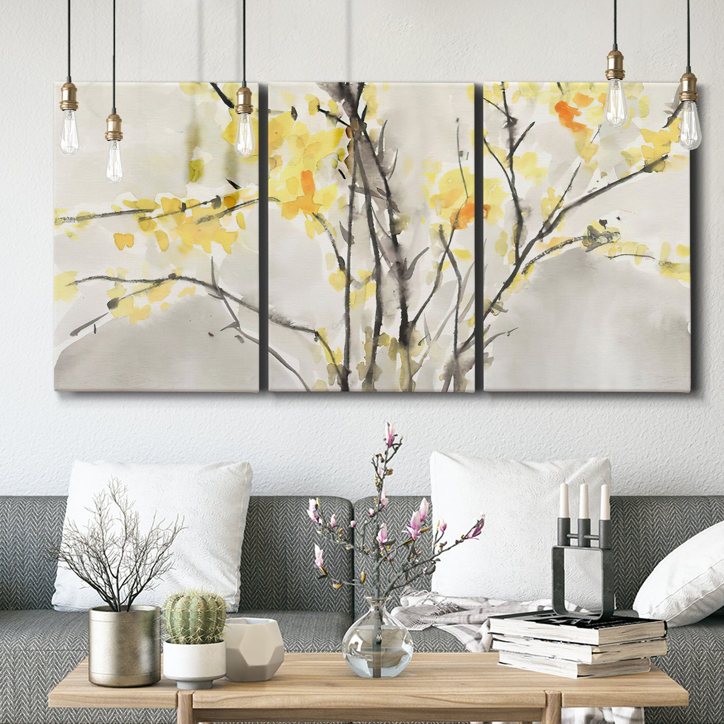 Three-panel canvas wall art featuring soft floral abstract harmony, displayed in a modern living room above seating.