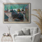 Impressionist coastal beach scene with boats by Claude Monet in an ornate champagne frame displayed in a bright interior setting.