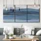 Three-panel canvas wall art featuring wide lake with distant shoreline, displayed in a modern living room above seating.
