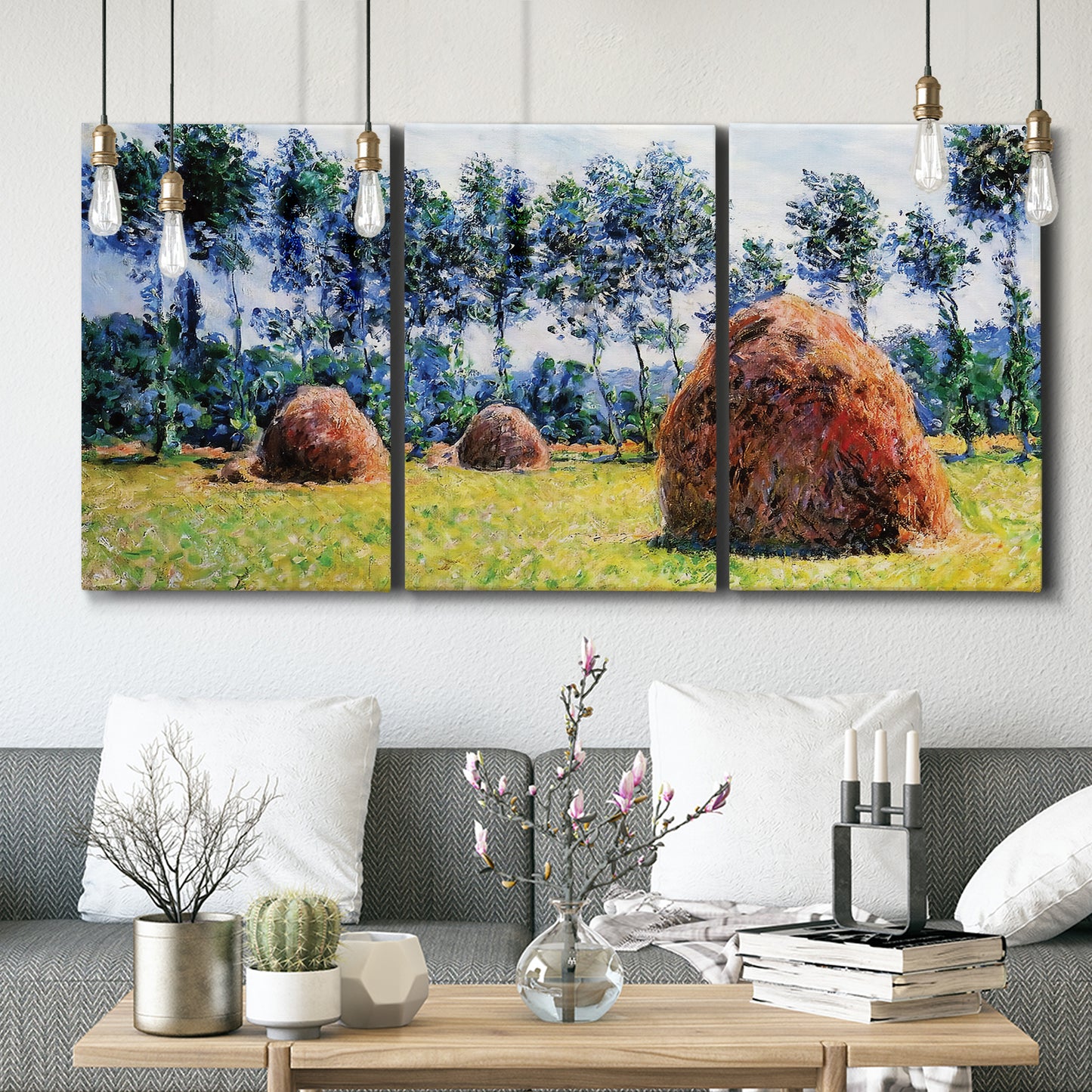 Three-panel canvas wall art featuring harvested grainstacks in field, displayed in a modern living room above seating.