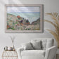 Impressionist coastal watch cabin scene by Claude Monet in an ornate weathered white frame displayed in a bright interior setting.
