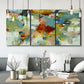 Three-panel canvas wall art featuring celebratory abstract color movement, displayed in a modern living room above seating.