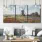 Three-panel canvas wall art featuring tulip fields with windmill, displayed in a modern living room above seating.
