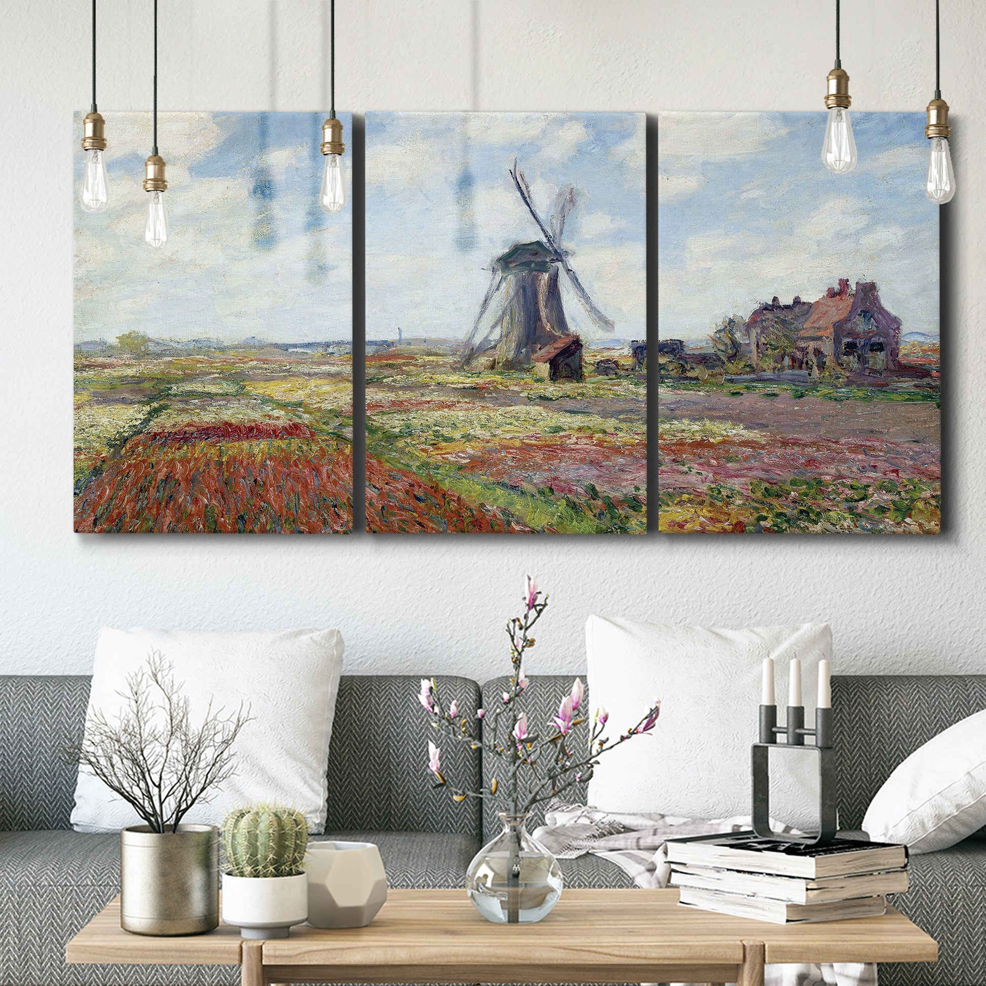 Three-panel canvas wall art featuring tulip fields with windmill, displayed in a modern living room above seating.