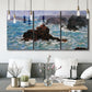 Three-panel canvas wall art featuring storm waves battering rocky coast, displayed in a modern living room above seating.