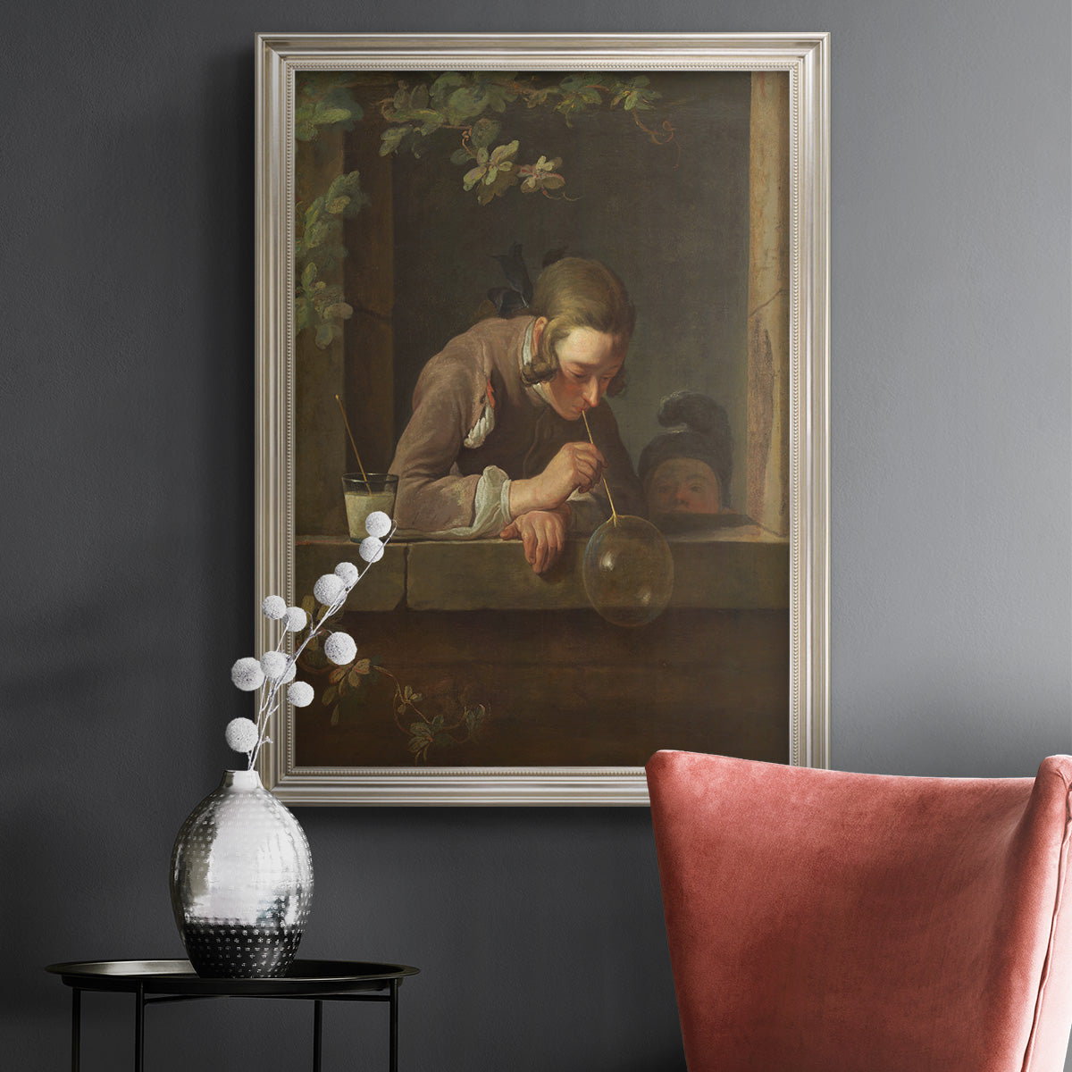 Classical genre painting of a child blowing soap bubbles by Jean-Siméon Chardin in an ornate champagne frame displayed in a dark-toned interior setting.