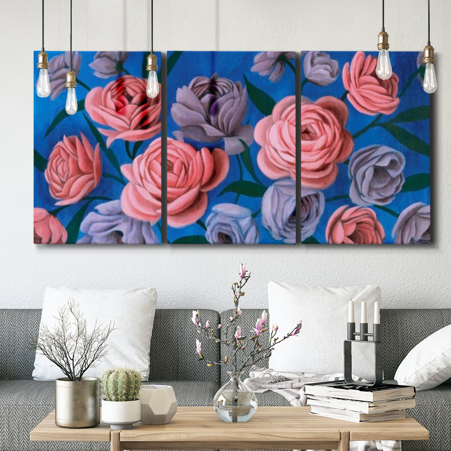 Three-panel canvas wall art featuring layered botanical petal abstractions, displayed in a modern living room above seating.