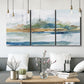 Three-panel canvas wall art featuring flowing blue abstract watercolor, displayed in a modern living room above seating.