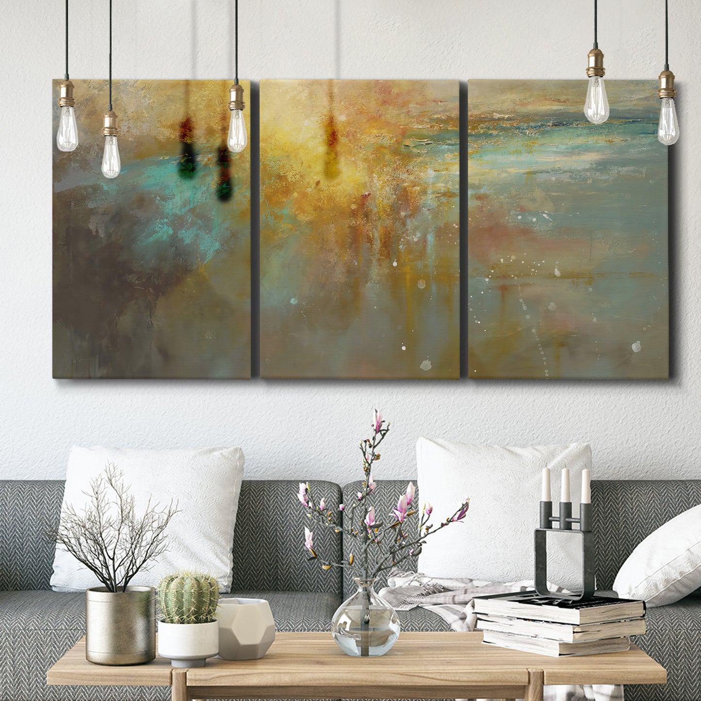 Three-panel canvas wall art featuring muted abstract river inspired tones, displayed in a modern living room above seating.