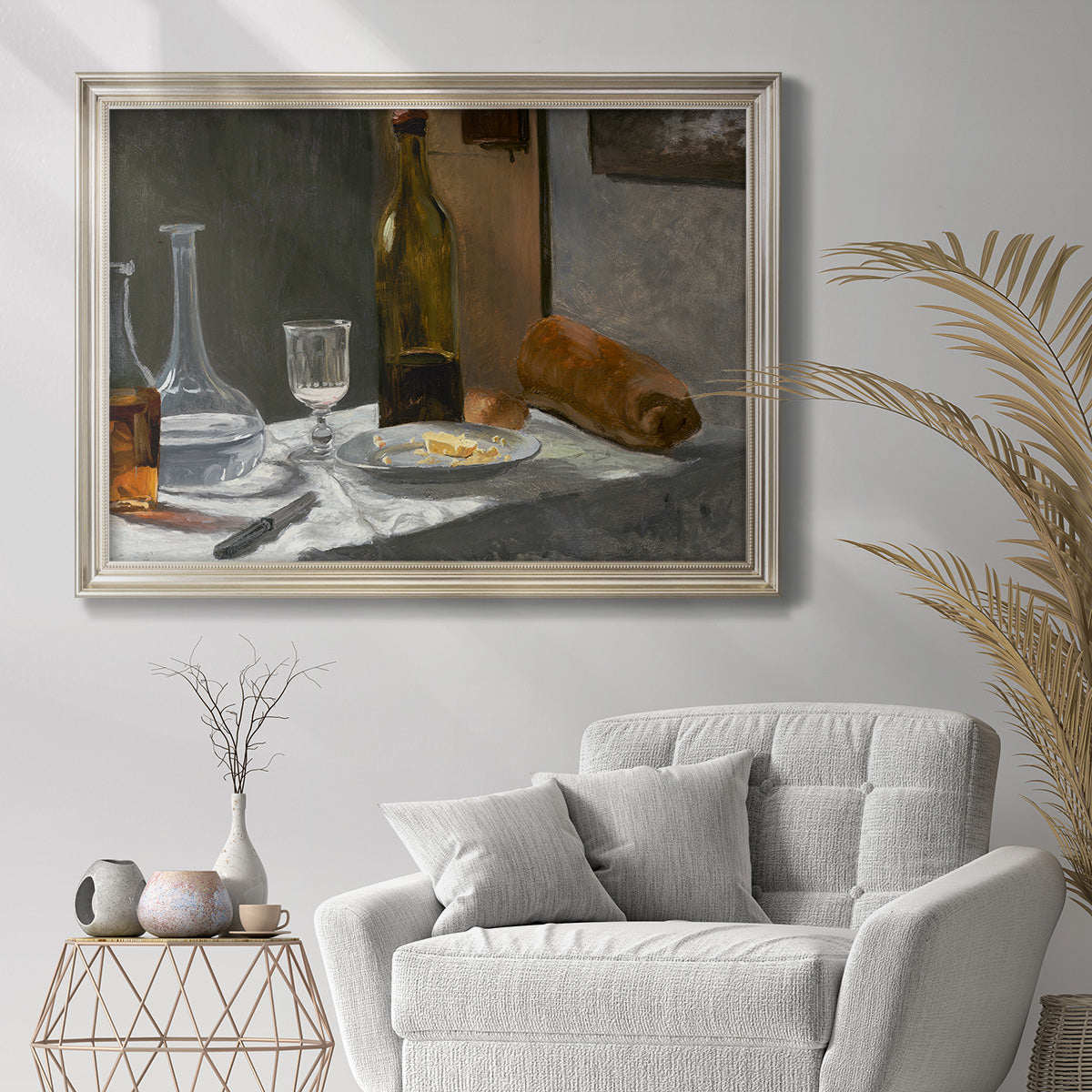 Impressionist still life with wine and bread by Claude Monet in an ornate champagne frame displayed in a bright interior setting.