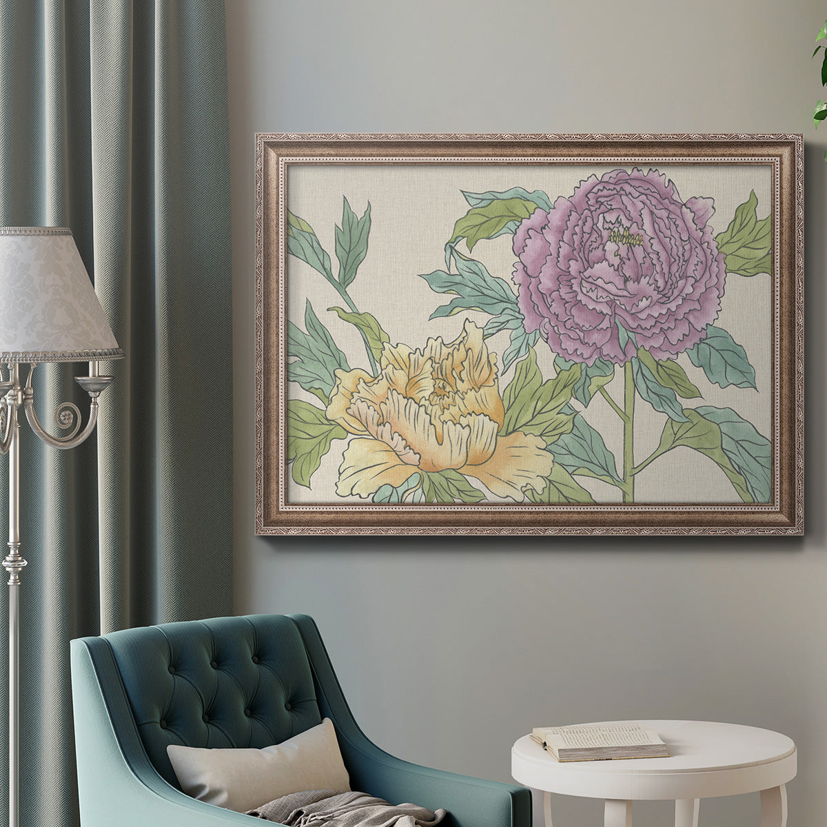Contemporary peony flower illustration in an ornate traditional silver frame displayed in a neutral interior setting.
