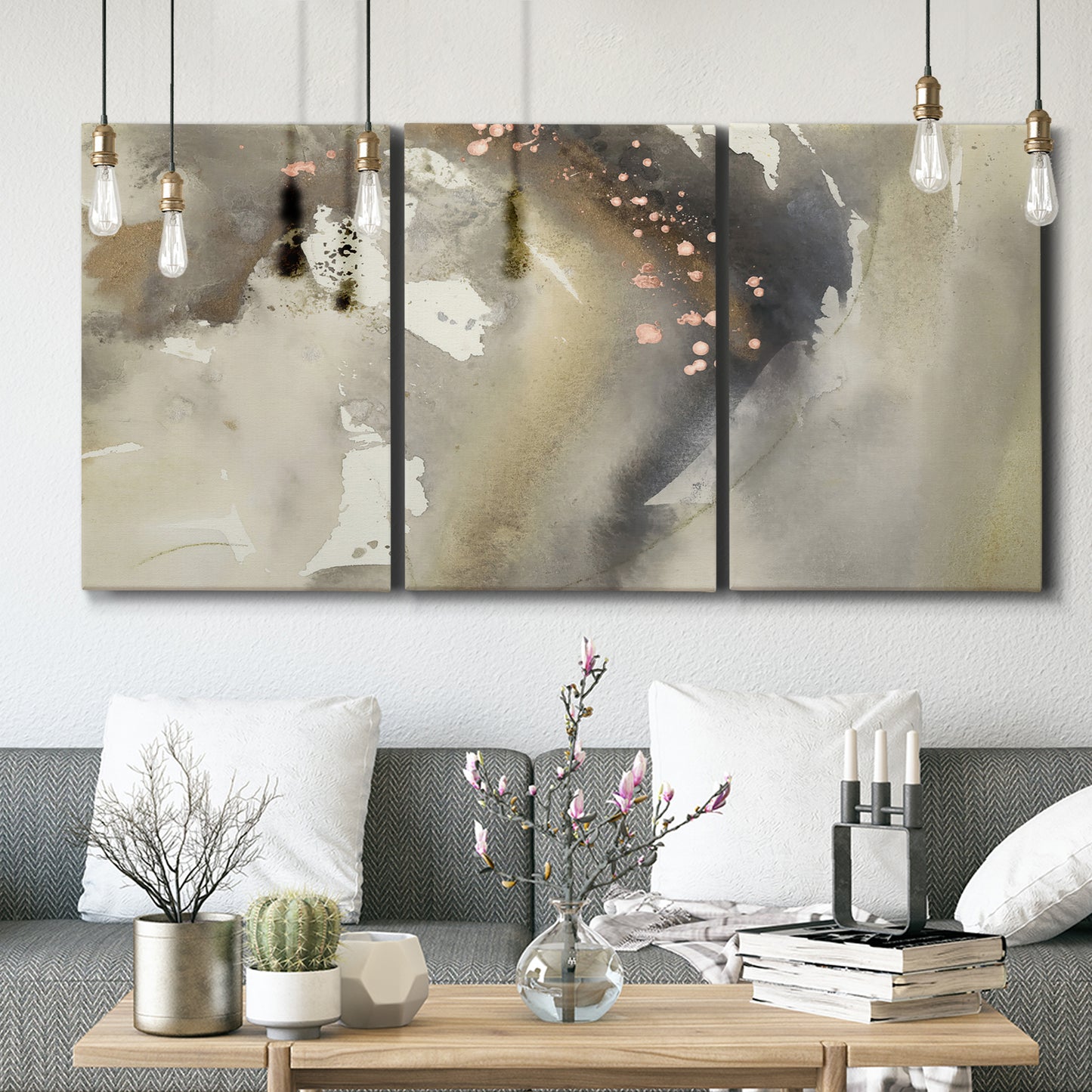 Three-panel canvas wall art featuring flowing abstract wave motion, displayed in a modern living room above seating.