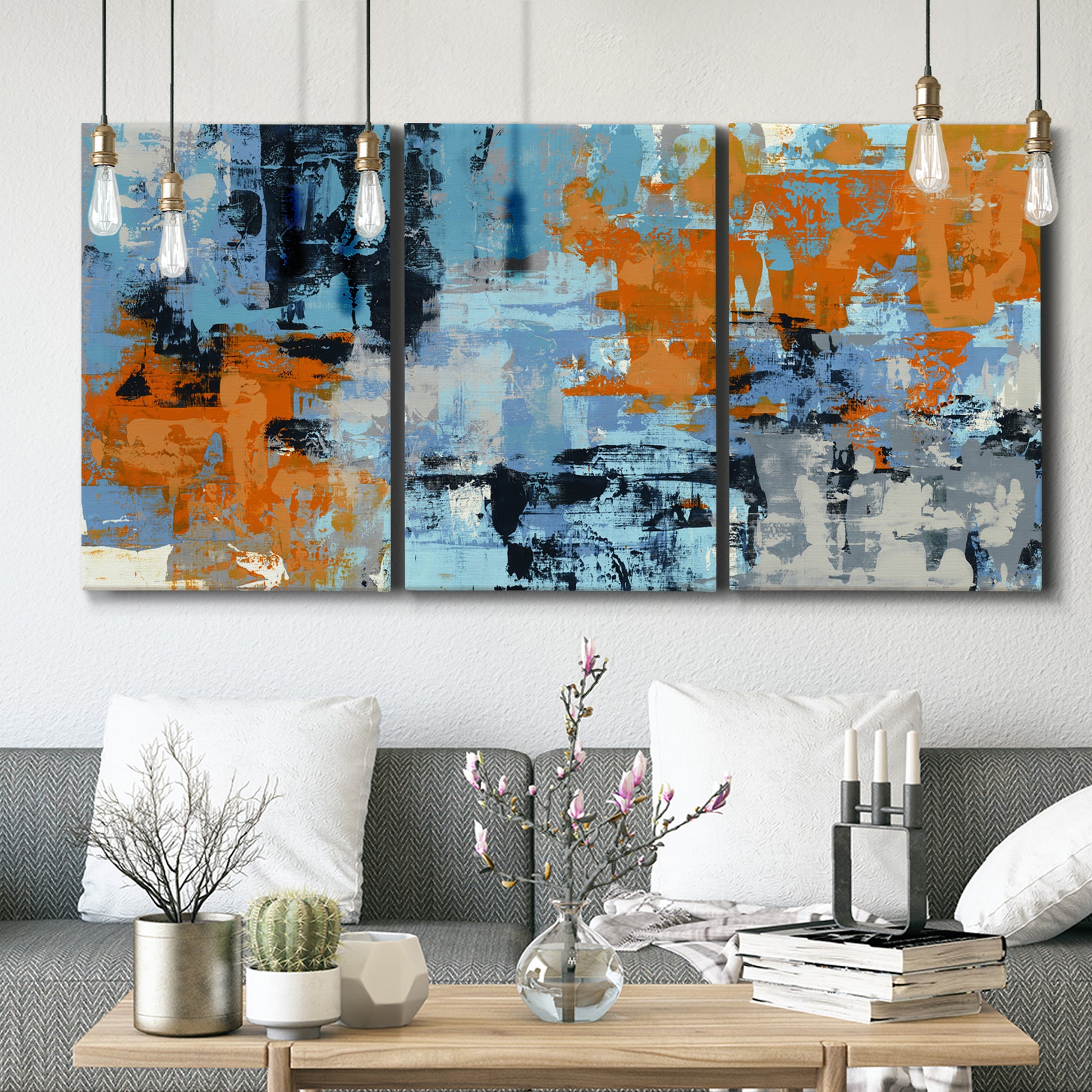 Three-panel canvas wall art featuring mid century abstract playground shapes, displayed in a modern living room above seating.