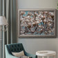 Contemporary dogwood blossom floral photography in an ornate vintage silver frame displayed in a neutral interior setting.