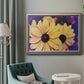 Bright black-eyed Susan flower photography in an ornate vintage silver frame displayed in a neutral interior setting.