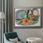 Bold modern botanical illustration in an ornate vintage silver frame displayed in a neutral interior setting.
