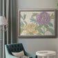 Contemporary peony flower illustration in an ornate vintage silver frame displayed in a neutral interior setting.