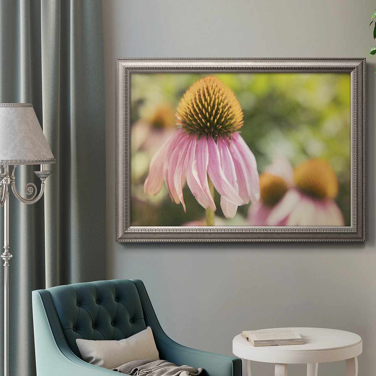 Close-up echinacea bloom photography in an ornate vintage silver frame displayed in a neutral interior setting.