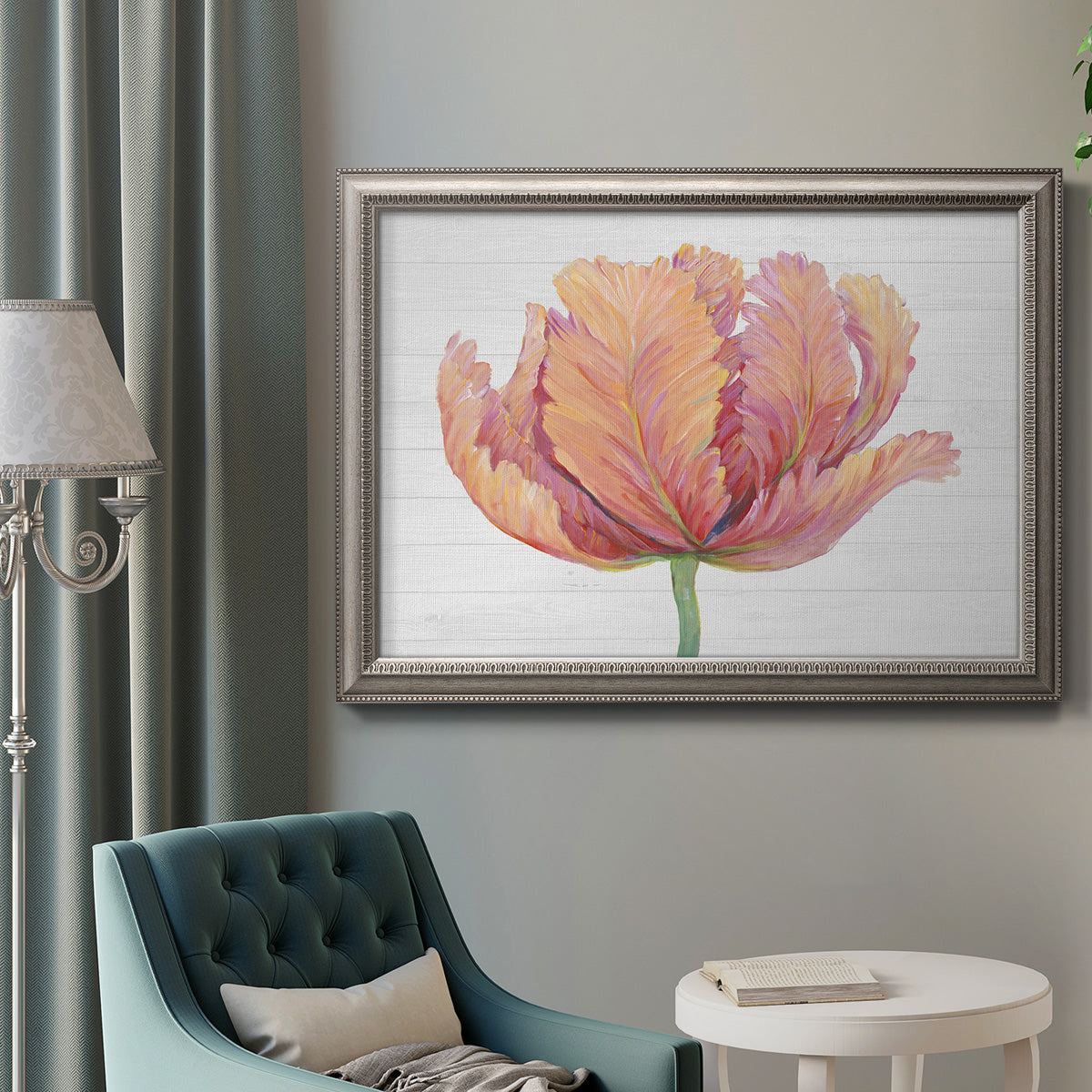 Minimalist pink flower abstract artwork in an ornate vintage silver frame displayed in a neutral interior setting.