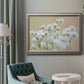 Delicate baby’s breath floral photograph in an ornate vintage silver frame displayed in a neutral interior setting.