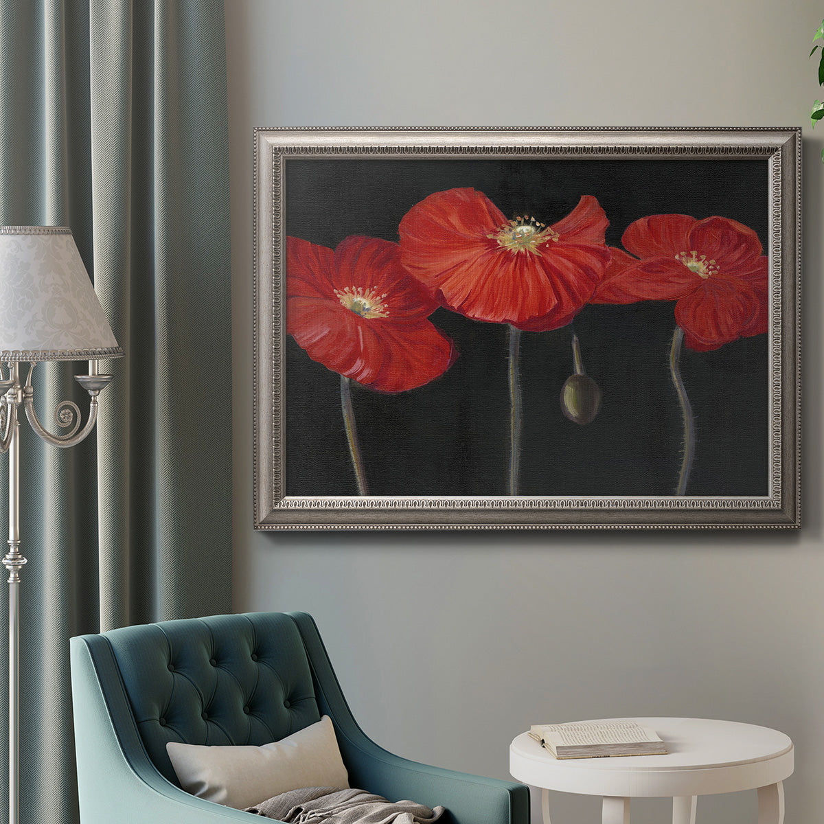 Modern red poppy floral artwork in an ornate vintage silver frame displayed in a neutral interior setting.