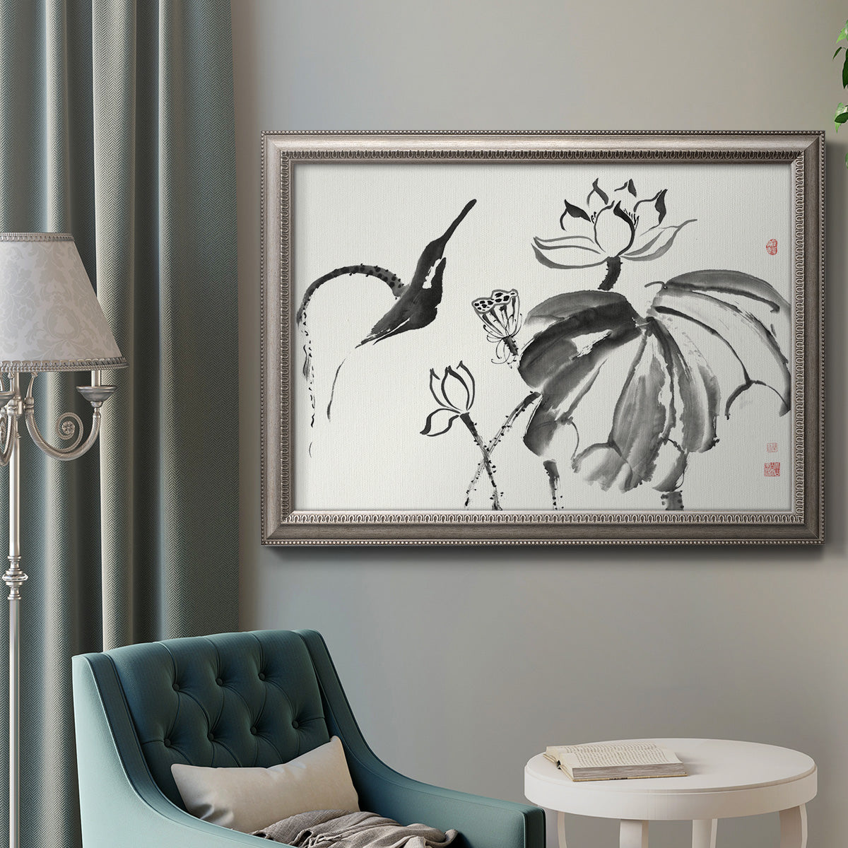 Asian-inspired lotus flower illustration in an ornate vintage silver frame displayed in a neutral interior setting.