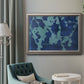 Blue abstract botanical in an ornate vintage silver frame displayed in a neutral interior setting.