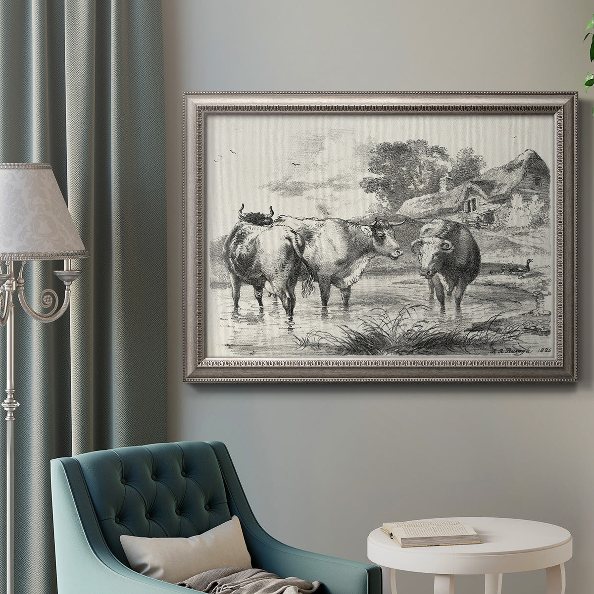 Classical rural landscape artwork by Nicolas Berchem in an ornate vintage silver frame displayed in a neutral interior setting.