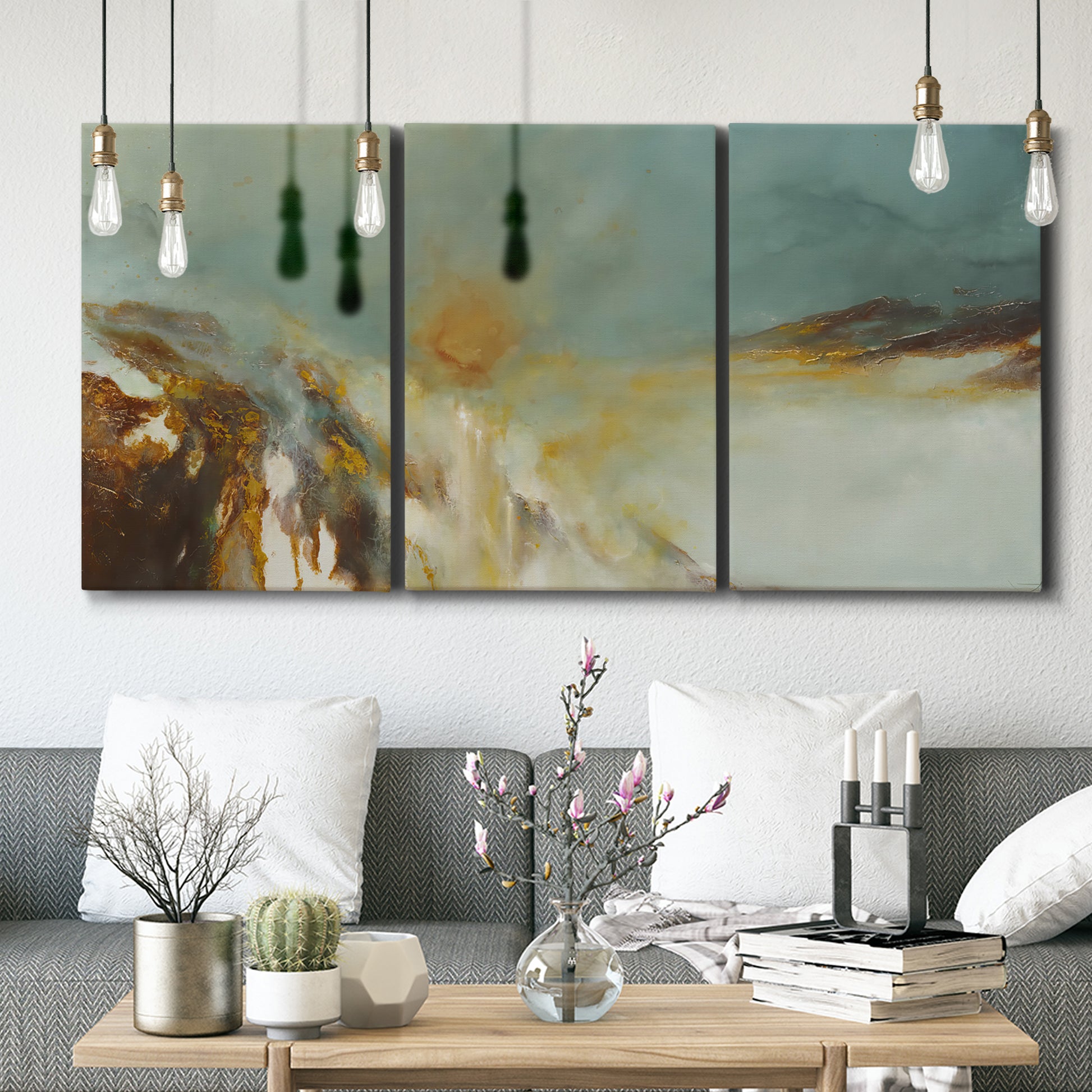 Three-panel canvas wall art featuring earth toned abstract solar landscape, displayed in a modern living room above seating.