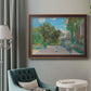 Impressionist residential landscape at Argenteuil by Claude Monet in an ornate bronzed mahogany wood frame displayed in a bright interior setting.