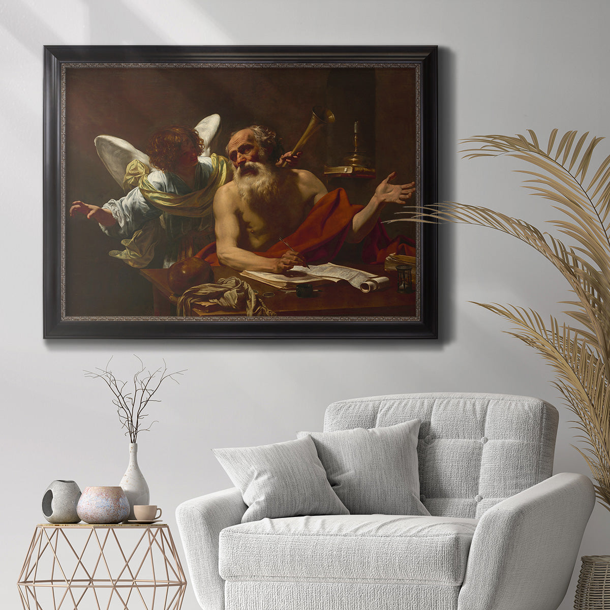 Classical religious painting of Saint Jerome with an angel by Simon Vouet in an ornate black frame with gilded inner detail displayed in a bright interior setting.