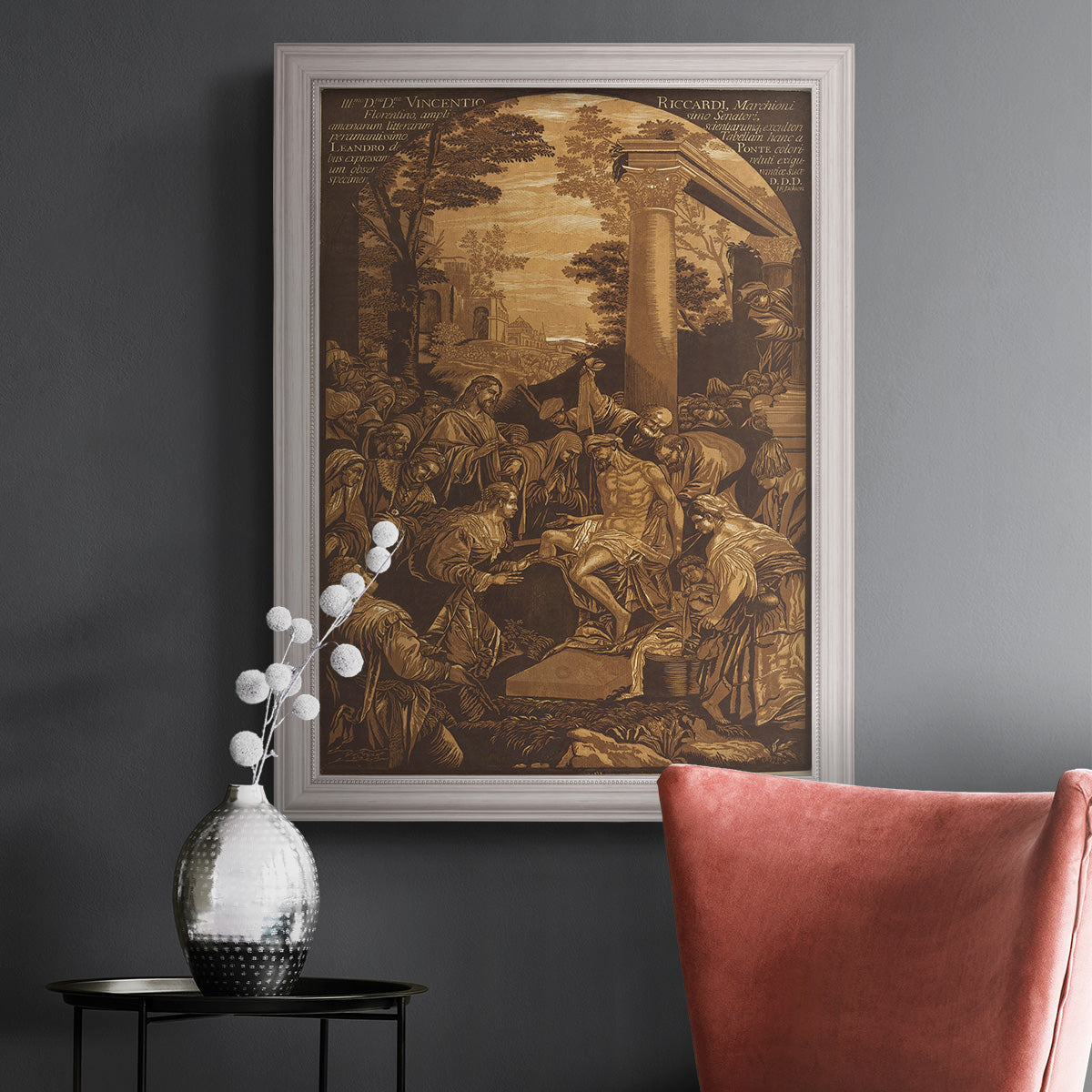 Monochrome religious painting of the raising of Lazarus by Leandro Bassano in an ornate weathered white frame displayed in a dark-toned interior setting.