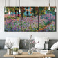Three-panel canvas wall art featuring blooming irises in garden bed, displayed in a modern living room above seating.
