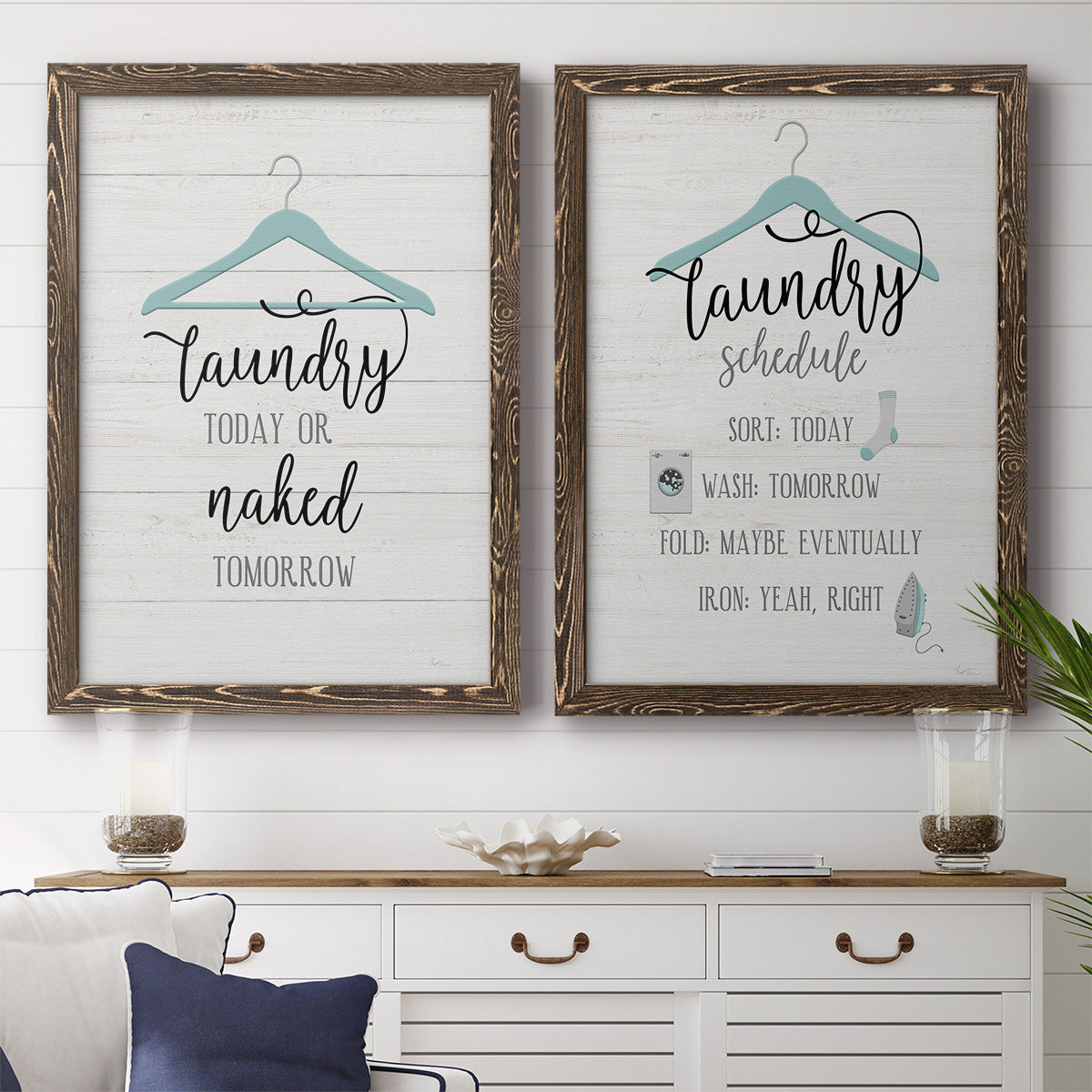 Set of two walnut barnwood framed canvas prints depicting a coordinated art pair of humorous laundry-room sayings and clothing icons rendered as rustic typographic wall art above a dining room sideboard.