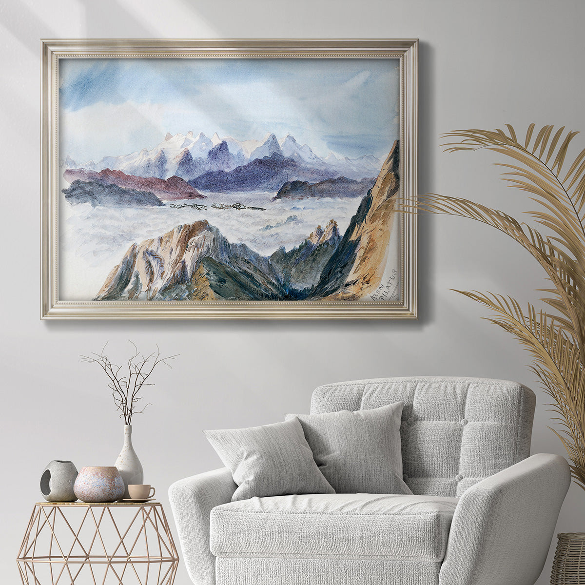 Impressionist alpine mountain landscape by John Singer Sargent in an ornate champagne frame displayed in a bright interior setting.